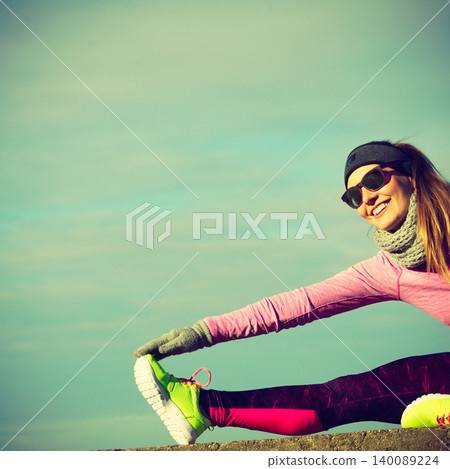Woman fitness sport girl training outdoor in cold weather Woman fitness sport girl training outdoor in cold weather 140089224