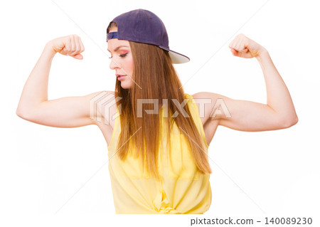 Woman casual style showing off muscles biceps 140089230