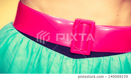 Pink belt on blue tulle skirt Pink belt on blue tulle skirt 140089239