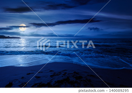 black sea landscape in summer at night. full moon over bulgaria nature landscape with sandy beach. mysterious summer vacation at the sea shore concept. waves and empty beach. remote vacation scene black sea landscape in summer at night. full moon over bulgaria nature landscape with sandy beach. mysterious summer vacation at the sea shore concept. waves and empty beach. remote vacation scene 140089295