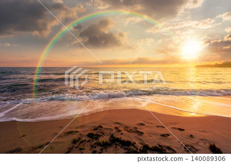 sunset over black sea landscape in summer. bulgaria nature landscape with sandy beach. summer vacation at the sea shore concept. waves and empty beach. remote vacation scene. weather with rainbow sunset over black sea landscape in summer. bulgaria nature landscape with sandy beach. summer vacation at the sea shore concept. waves and empty beach. remote vacation scene. weather with rainbow 140089306