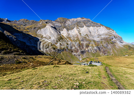 Hiking trail in Cirque de Troumouse at Heas in the Hautes-Pyrenees department in France, forming the border with Spain Hiking trail in Cirque de Troumouse at Heas in the Hautes-Pyrenees department in France, forming the border with Spain 140089382