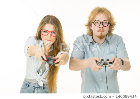 Gaming couple playing games Gaming couple playing games 140089434