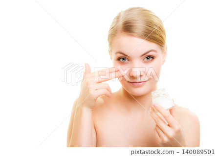 Skin care. Girl applying moisturizing cream Skin care. Girl applying moisturizing cream 140089501