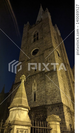 Dublin, Ireland - May 31, 2023: Gothic church spire after sunset Dublin, Ireland - May 31, 2023: Gothic church spire after sunset 140089527