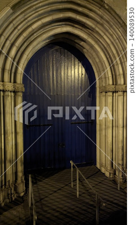 Dublin, Ireland - May 31, 2023: illuminated arched church entrance Dublin, Ireland - May 31, 2023: illuminated arched church entrance 140089530