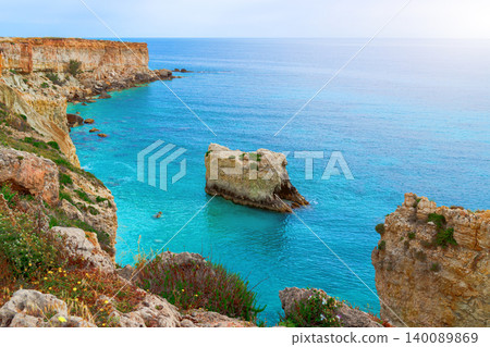 Scenic summer vacation seascape with turquoise waters and rocky cliffs Scenic summer vacation seascape with turquoise waters and rocky cliffs 140089869