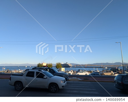 Ushuaia, Tierra del Fuego, Argentina - March 6, 2026: Evening view of the harbor area and Beagle Channel shoreline 140089954