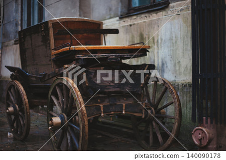 Vintage wooden horse-drawn carriage parked Vintage wooden horse-drawn carriage parked 140090178
