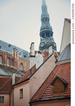Medieval Church Spire with Clock Tower Rising Above Medieval Church Spire with Clock Tower Rising Above 140090398
