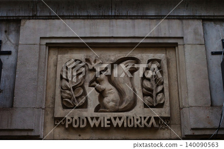 Detailed stone relief of a squirrel on a historical building Detailed stone relief of a squirrel on a historical building 140090563