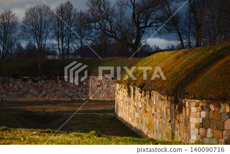 Scenic View of Ancient Stone Fortress Walls and Grass Scenic View of Ancient Stone Fortress Walls and Grass 140090716