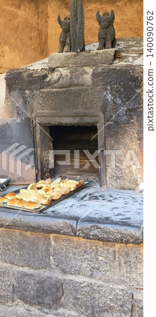 A traditional Inca clay oven with tray baking in Peru A traditional Inca clay oven with tray baking in Peru 140090762