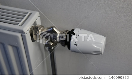 Thermostatic Radiator Valve on a White Radiator Thermostatic Radiator Valve on a White Radiator 140090823