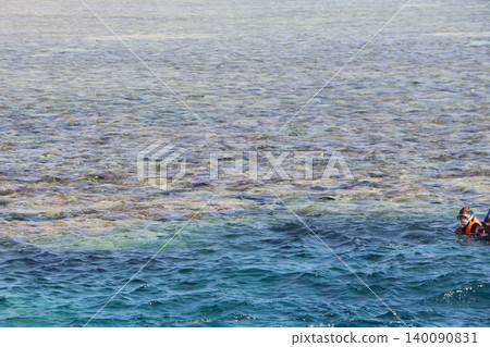 Tropical Sea with Boat and Snorkelers in Clear Shallow Water 140090831