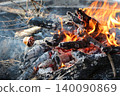 Roasting food and marshmallow over a campfire 140090869