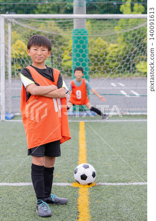 A young soccer player strikes a pose. A young soccer player strikes a pose. 140091613