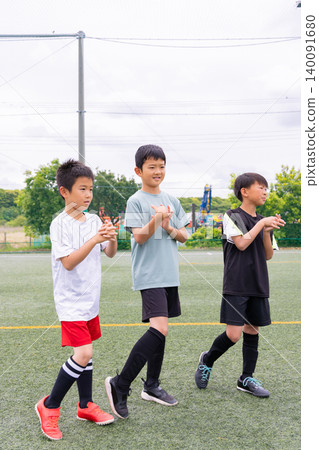 A boys' team stretching before soccer practice. 140091680