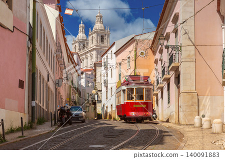 Historic Red Tram on Street with National Pantheon in Lisbon Portugal Historic Red Tram on Street with National Pantheon in Lisbon Portugal 140091883