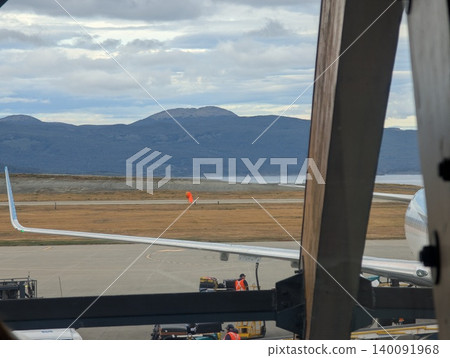 Ushuaia, Tierra del Fuego, Argentina - March 9, 2026: Airport apron, Beagle Channel and mountains in Tierra del Fuego Ushuaia, Tierra del Fuego, Argentina - March 9, 2026: Airport apron, Beagle Channel and mountains in Tierra del Fuego 140091968