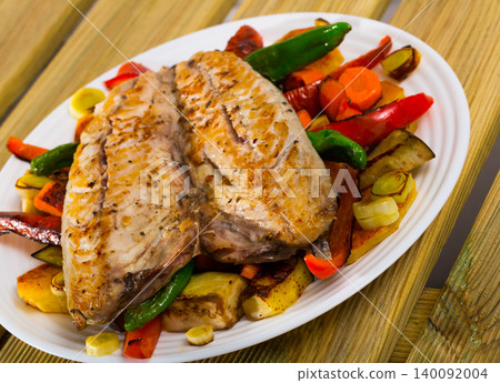 Baked spanish mackerel and different vegetables at plate, bulgarian cuisine Baked spanish mackerel and different vegetables at plate, bulgarian cuisine 140092004