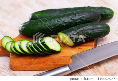 Fresh cucumbers with chopped slices Fresh cucumbers with chopped slices 140092027