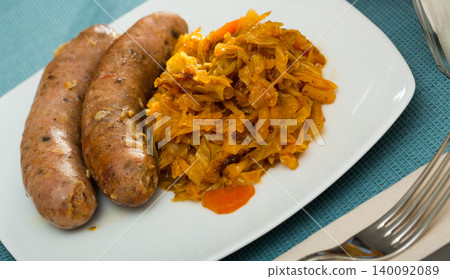 Sausages with stewed cabbage Sausages with stewed cabbage 140092089