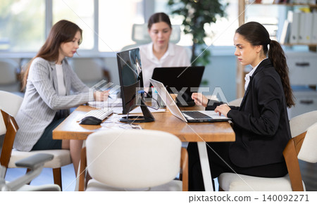 Group of young colleagues working in office Group of young colleagues working in office 140092271
