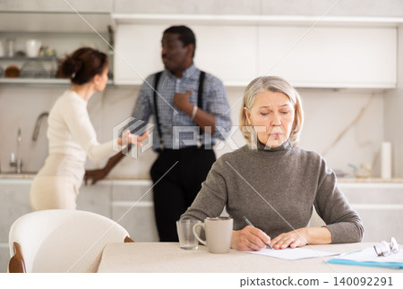 Mature woman relatives tell her who to include in her testament Mature woman relatives tell her who to include in her testament 140092291