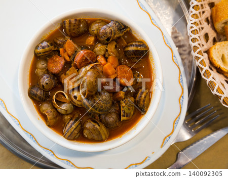 Top view of snails stewed with chorizo 140092305