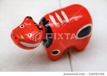 A lucky charm that wards off evil spirits and disease and brings good fortune... The traditional folk toy of Aizu, "Akabeko" 140092306