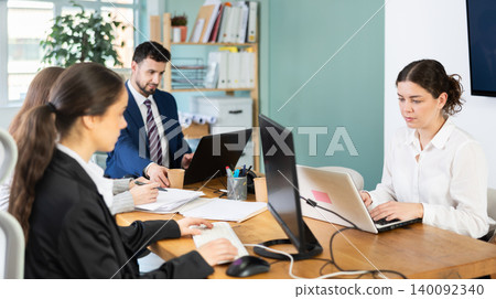 Group of young colleagues working in office Group of young colleagues working in office 140092340