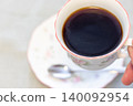 A cup full of coffee 140092954