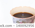 A cup filled with coffee 140092956