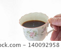 A cup filled with coffee 140092958