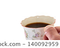 A cup filled with coffee 140092959