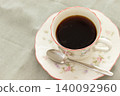 A coffee cup filled with coffee 140092960