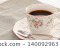 A coffee cup filled with coffee 140092963
