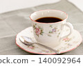 Coffee cup, saucer, and spoon 140092964