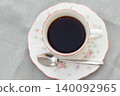 A coffee cup filled with coffee 140092965