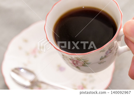 A cup filled with coffee A cup filled with coffee 140092967