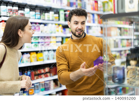Couple spends time in store, looking for goods and select perfume 140093200