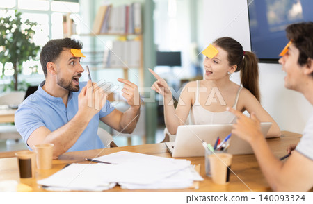 Office employees playing a guessing game Office employees playing a guessing game 140093324