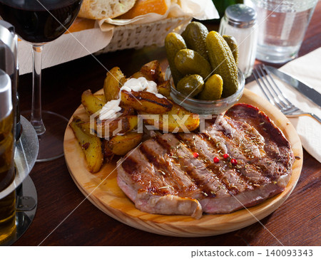 Grilled beef with fried potatoes Grilled beef with fried potatoes 140093343