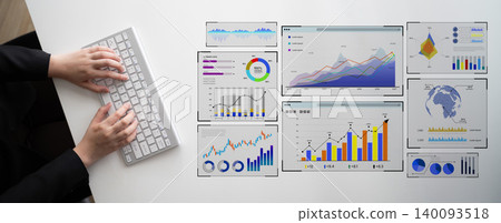 Business professional analyzing data with graphs and charts on desktop for performance metrics and strategic planning in modern workspace. Bitwise 140093518