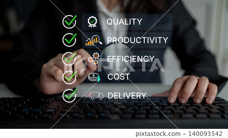 Business Professional Analyzing Key Performance Indicators on Keyboard with Checkmarks for Quality, Productivity, Efficiency, Cost, and Delivery. Bitwise 140093542