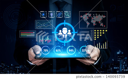 Business Professional Holding Tablet with Digital Data Visualization and Analytics Graphics in a Corporate Environment at Night Fluxor 140093739