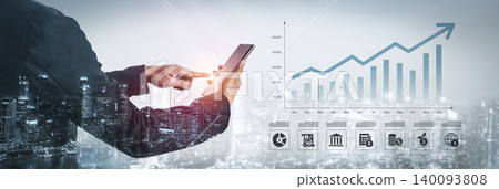 Business Professional Using Mobile Device to Monitor Growth Trends with Financial Data Overlaid on City Skyline in Background Ledger Business Professional Using Mobile Device to Monitor Growth Trends with Financial Data Overlaid on City Skyline in Background Ledger 140093808