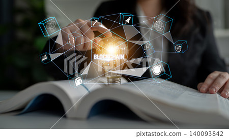 Professional businesswoman using blockchain technology, hand touching light bulb symbol, data and innovation concept on open book in modern office setting Quark Professional businesswoman using blockchain technology, hand touching light bulb symbol, data and innovation concept on open book in modern office setting Quark 140093842