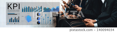 Business professionals analyzing Key Performance Indicators with digital devices, graphs, statistics, and data visualizations in a corporate setting Gantry Business professionals analyzing Key Performance Indicators with digital devices, graphs, statistics, and data visualizations in a corporate setting Gantry 140094034